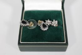 A pair of 9ct gold and diamond and sapphire earrings in a box,