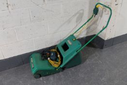 A Qualcast electric lawn mower together with a Black and Decker corded drill