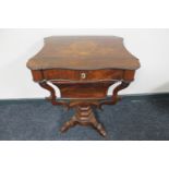 A 19th century inlaid rosewood pedestal work table