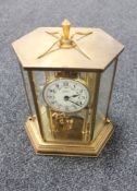 A brass cased Bentima anniversary clock with key
