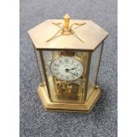 A brass cased Bentima anniversary clock with key