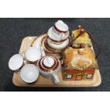 A tray containing a twenty-two piece Royal Stafford bone china tea service together with a cottage
