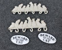 Two cast metal coats racks and two cast metal beware of the cat signs