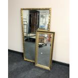 A gilt framed overmantel mirror together with a gilt framed bevelled hall mirror