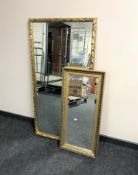 A gilt framed overmantel mirror together with a gilt framed bevelled hall mirror