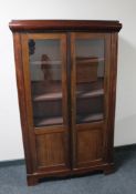 An early 20th century continental mahogany double door bookcase