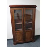 An early 20th century continental mahogany double door bookcase