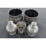 A pair of Indian style metal table lamps together with two metal planters and an ice bucket