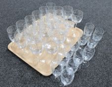 Eleven etched wine glasses with two further sets of twelve matching glasses