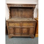 A late Victorian carved oak buffet sideboard,