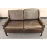 A mid twentieth century Danish brown leather two seater settee CONDITION REPORT: