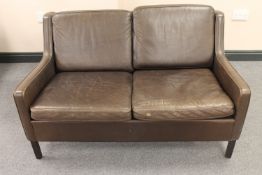 A mid twentieth century Danish brown leather two seater settee CONDITION REPORT: