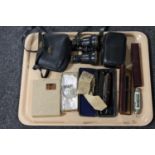 A tray containing vintage cut throat razors, set of 19th century field glasses in case,
