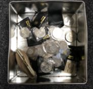 A tin containing a quantity of British Crowns,