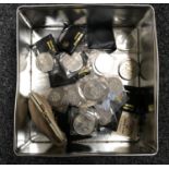 A tin containing a quantity of British Crowns,