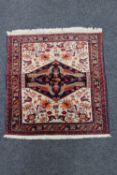 A Persian hearth rug,