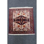 A Persian hearth rug,