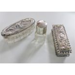 A silver embossed dressing table box,