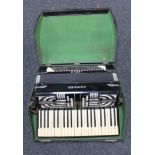 ** Lot withdrawn from auction ** A cased Hohner Verde III accordion