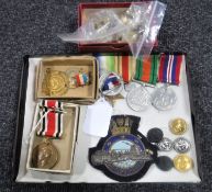 An interesting collection of WWII medals, commemorative medals, military buttons, badges etc.