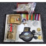 An interesting collection of WWII medals, commemorative medals, military buttons, badges etc.