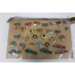 Thirty mid 20th century tin pin badges all relating to automobiles