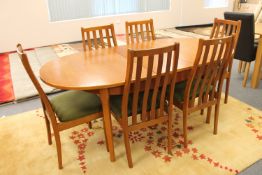 A twentieth century Stateroom teak oval extending table and six chairs