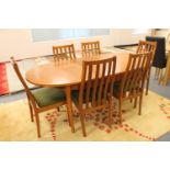 A twentieth century Stateroom teak oval extending table and six chairs