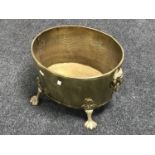 A Victorian brass coal bucket with lion mask handles on raised paw feet