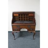 A mahogany Art Nouveau roll top writing desk