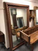 A carved wooden framed mirror,