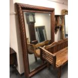 A carved wooden framed mirror,