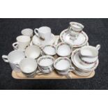 A tray of five commemorative mugs, part china tea service,