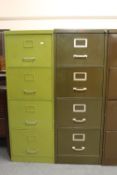 A mid twentieth century Howden four drawer metal filing cabinet with key together with one other