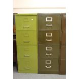 A mid twentieth century Howden four drawer metal filing cabinet with key together with one other