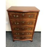 A reproduction continental ormolu mounted chest of five drawers,