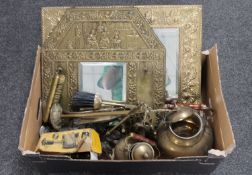 A box of two brass framed embossed mirrors, brass companion set, trivet,