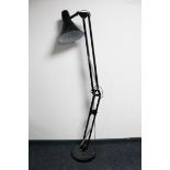 A black metal angle poise floor lamp (continental wiring)