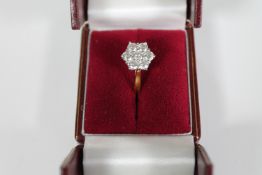 An 18ct gold and diamond cluster ring