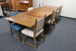 An early 20th century continental oak pull out dining table together with six chairs