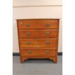 An Edwardian satinwood four drawer chest