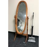 A pine cheval mirror together with a G Tech 22V air ram