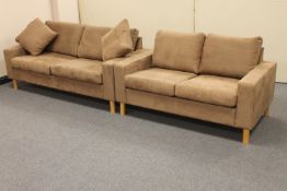A three seater and two seater settee upholstered in brown suede fabric