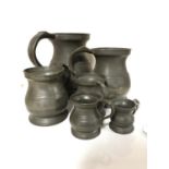 A set of six antique pewter tankards