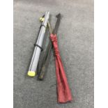 A Wilmex sea tackle rod tube containing two sea rods in bag,