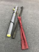 A Wilmex sea tackle rod tube containing two sea rods in bag,