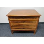 An antique continental mahogany four drawer chest on stand