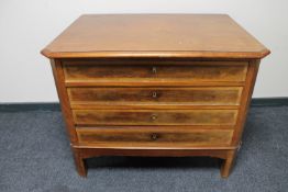 An antique continental mahogany four drawer chest on stand