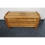 A carved oak blanket box