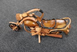 A hand built wooden model of a motorcycle